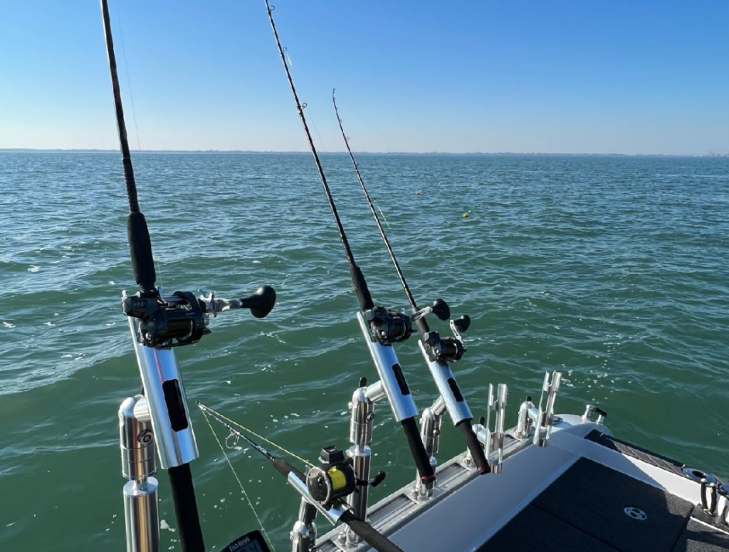 offshore trolling rods with conventional reels on boat