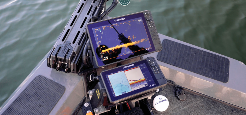 angler using fish finder electronics to locate crappie schools