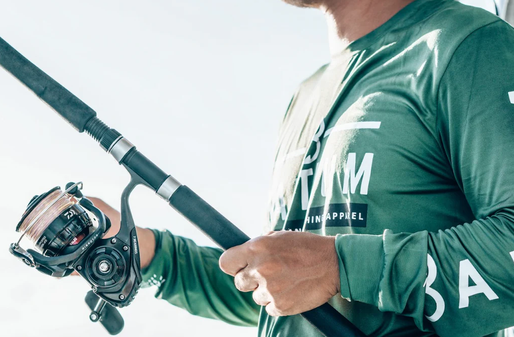 angler watching fishing rod tip and line for subtle fish bites