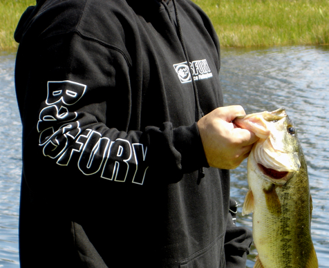 largemouth bass held by angler after catch